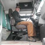 Turi Duhamel, 17, with the School District 19 bus he bought and is converting into a camper and workshop for his Revelstoke Secondary School capstone project, pictured Wednesday, Oct. 29. (Evert Lindquist/Revelstoke Review)