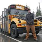 Turi Duhamel, 17, with the School District 19 bus he bought and is converting into a camper and workshop for his Revelstoke Secondary School capstone project, pictured Wednesday, Oct. 29. (Evert Lindquist/Revelstoke Review)