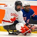 Team Canada Para Hockey veteran forward Greg Westlake (left) battles American foe Malik Jones for the puck at an international tournament in Czechia. Vernon’s Boris Rybalka is the head coach of Team Canada. (Canadian Paralympic Committee photo)