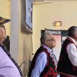Kitsumkalum Chief Negotiator Gerald Wesley (at podium) addresses the Nation while Chief Negotiator Alex Bolton (middle) and Chief Councillor Troy Sam look on during the Treaty and Constitution ratification event on Nov. 1, 2025. (Kitsumkalum)