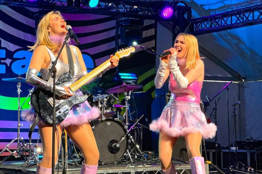 The Finn-Morris sisters of Fionn (Brianne, left, on guitar, and Alanna, holding microphone) perform during the Let’s Hear It BC JUNOS Plaza Party at Surrey Civic Plaza on March 15, 2025. (Photo: Tom Zillich)