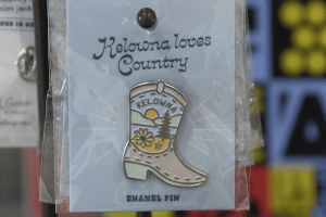 A pin designed to celebrate Country Music Week 2025 in Kelowna.